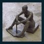 Seated iron woman.